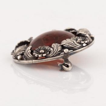 An NE From silver and amber brooch.