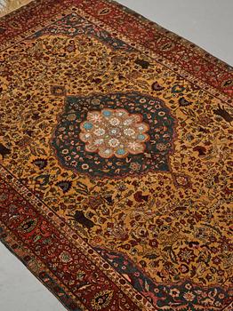 A rug, a semi-antique silk Turkish with metal brocade, ca 194-195 x 127,5-132,5 cm.