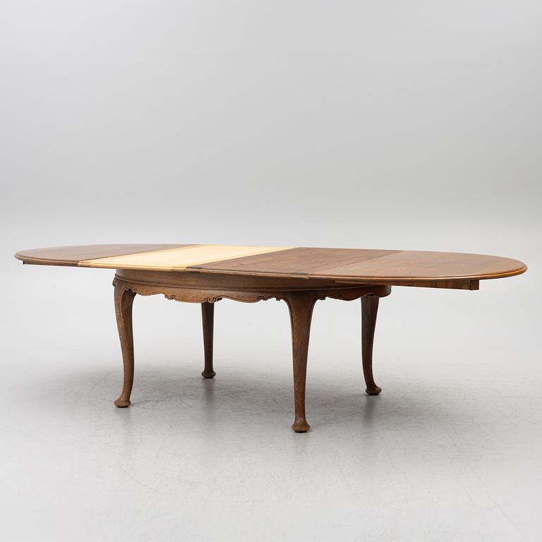 Dining table, 8 chairs, 2 armchairs, sideboard, Rococo style, early 20th century.