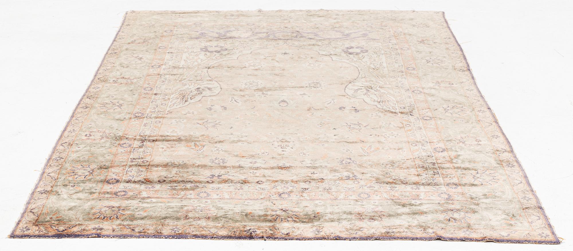 A Turkish rug, c. 185 x 125 cm.