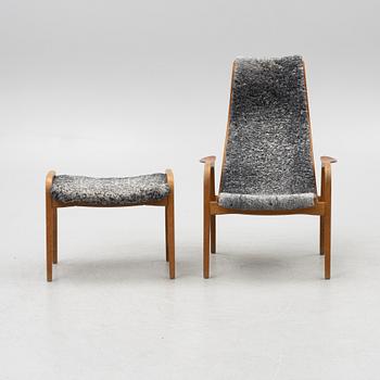 Yngve Ekström, an armchair and a footstool "Lamino", anniversary edition, Swedese.
