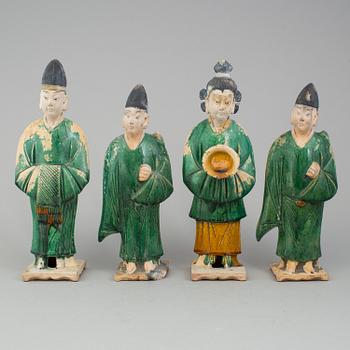A group of eight chinese figures with three objects, earthenware, Ming dynasty.