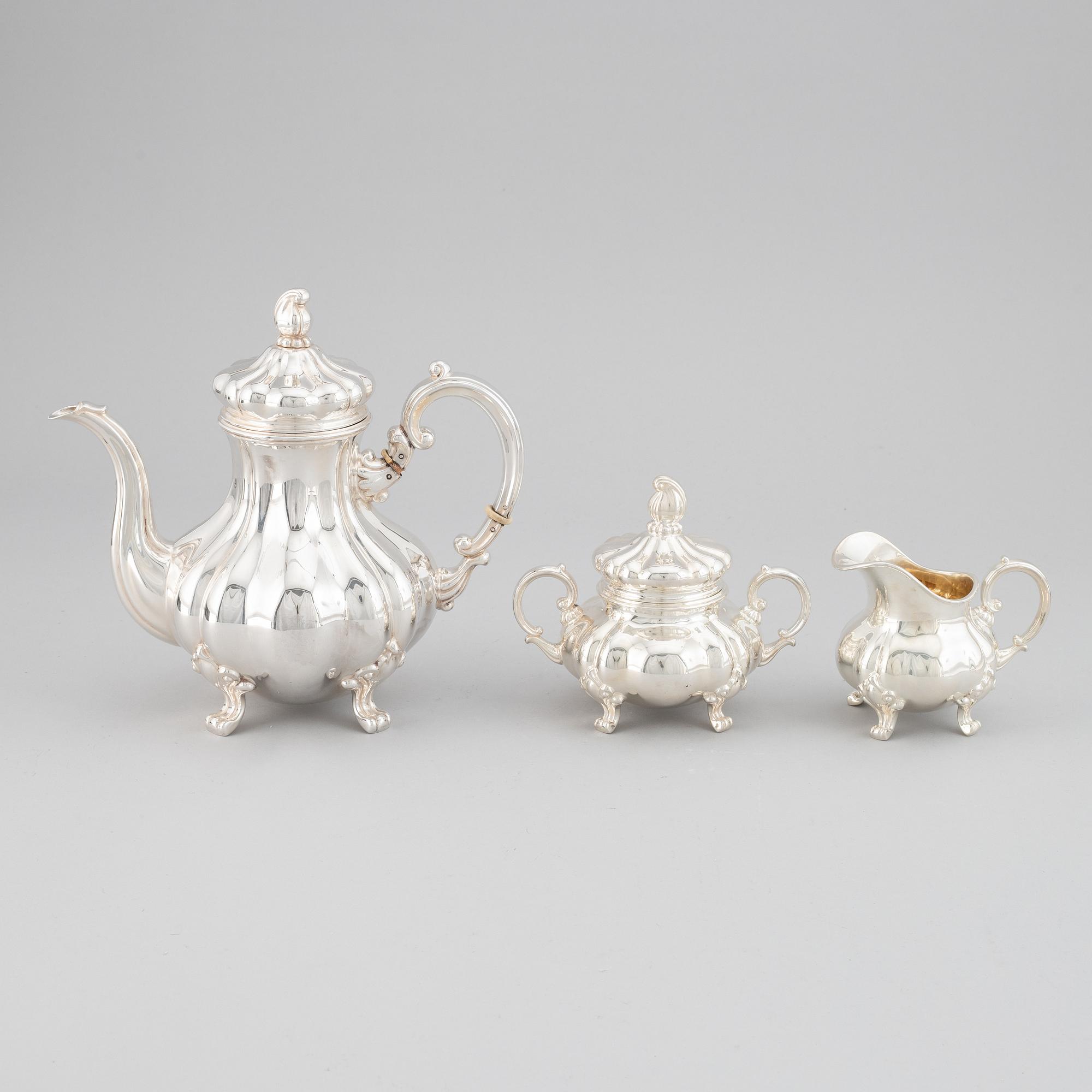 A 20th century silver coffee pot, creamer and sugar bowl. Swedish import mark.