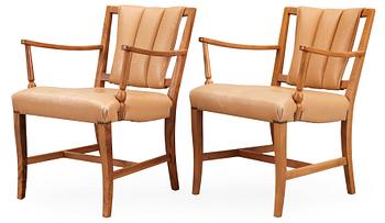 490. A pair of Josef Frank walnut and light brown leather armchairs, Svenskt Tenn.