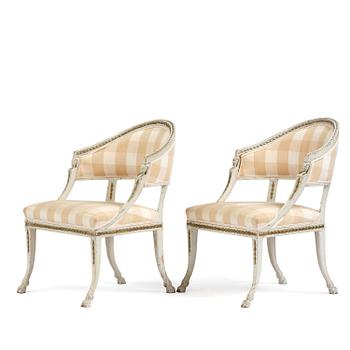 72. A pair of late Gustavian open armchairs by E. Ståhl (master in Stockholm 1794-1820).