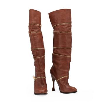 ALEXANDER MCQUEEN, a pair of brown leather boots.