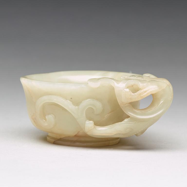 A carved nephrite Qilong goblet, Qing dynasty (1644-1912).