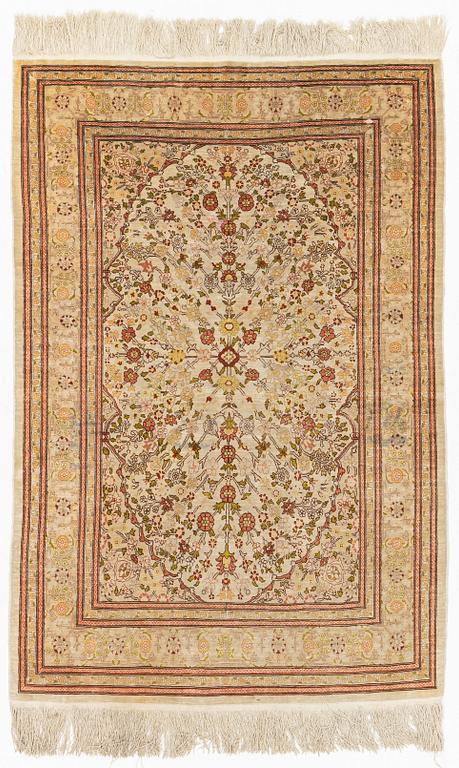 A Hereke silk rug, c. 130 x 87 cm.