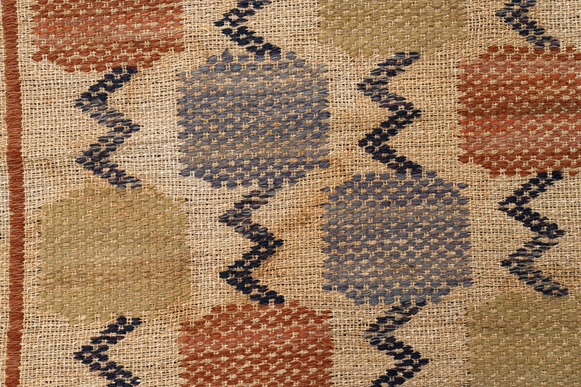 Märta Måås-Fjetterström, A textile, "Skaftblomman", flat weave, ca 131,5 x 47 cm, signed MMF.