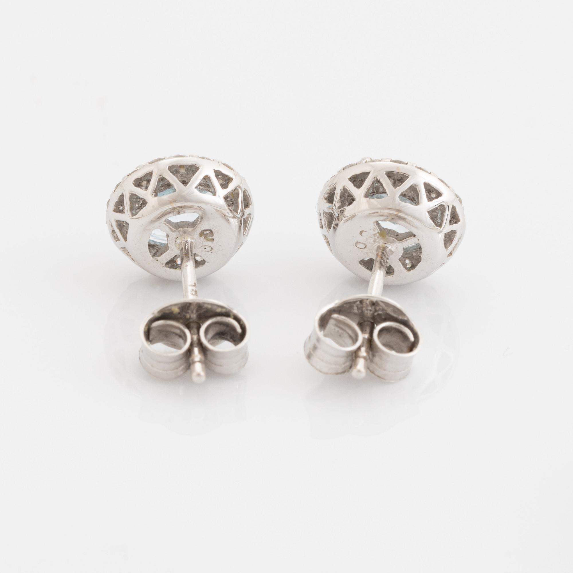 Blue topaz and brilliant cut diamond earrings and necklace.