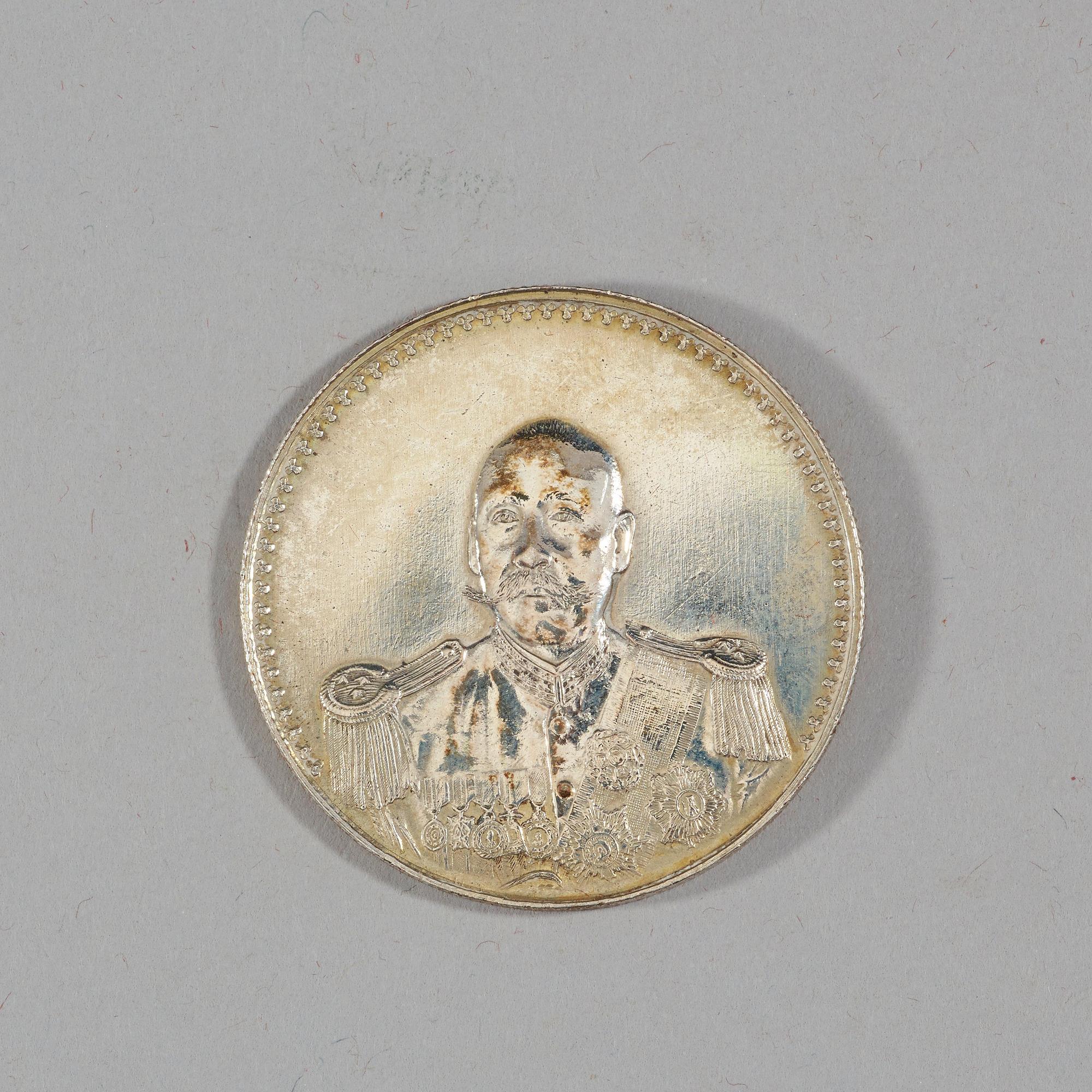 A box with five silver coins, Republic, early 20th Century.
