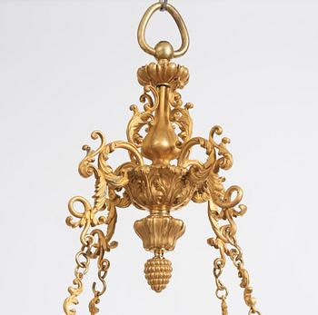 A rococo-revival gilt-brass sixteen-light chandelier, mid 19th century.
