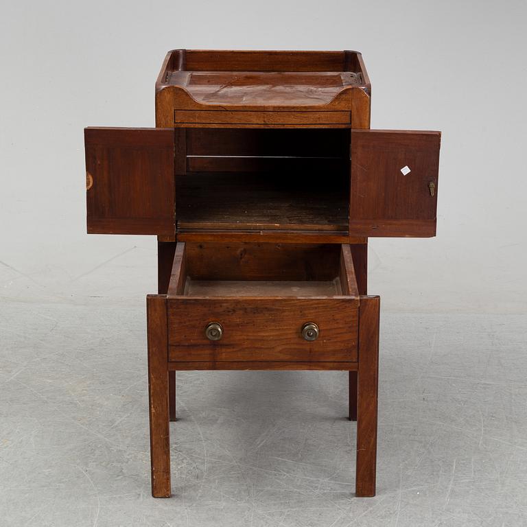 A mahogany bedside table, England, 19th century.