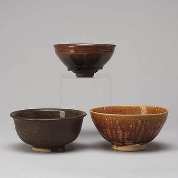 A group of three brown glazed bowls, China, 20th Century.