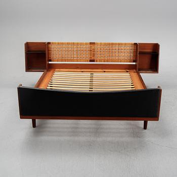 Hans J Wegner, a teak and rattan bed for Illums Bolighus, Getama, Denmark.