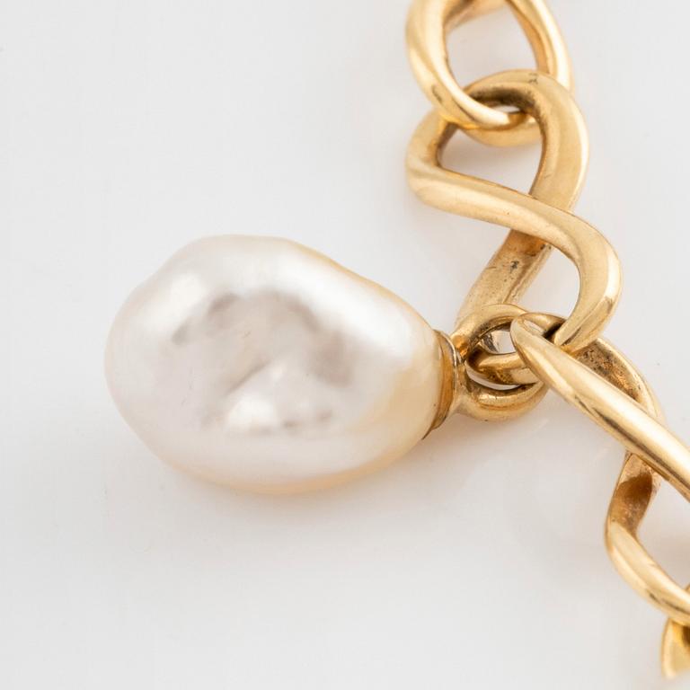 An 18K gold and cultured Keshi pearl bracelet.