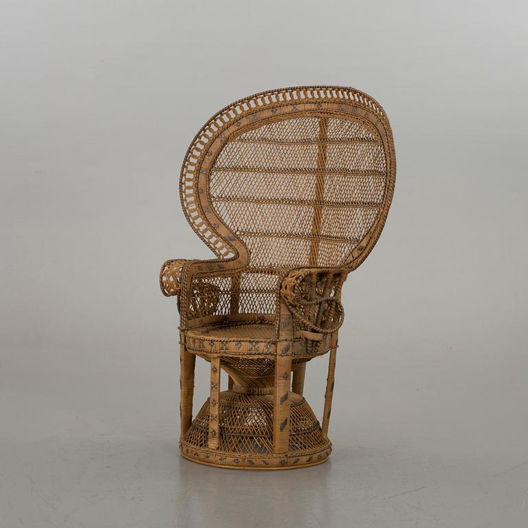 AN RATTAN ARMCHAIR.