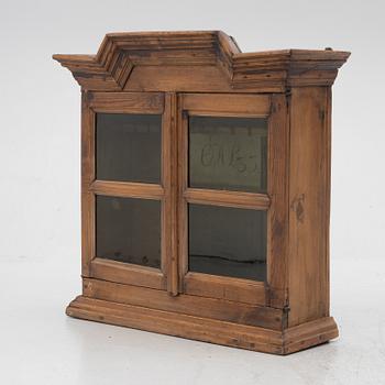 A 18th century wall vitrine cabinet.