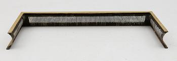 BRASSKYDD, mässing, 1900-talets första hälft.