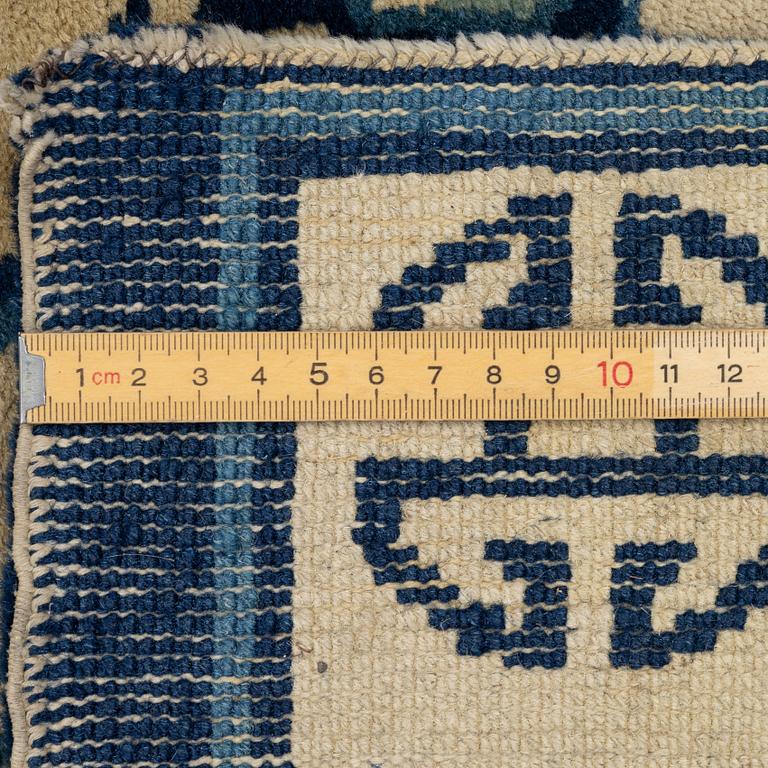 Two Chinese carpet fragments, late Qing dynasty.