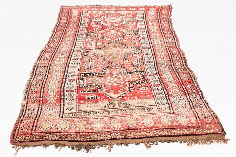 An oriental semi antique carpet, circa 272 x 120 cm.