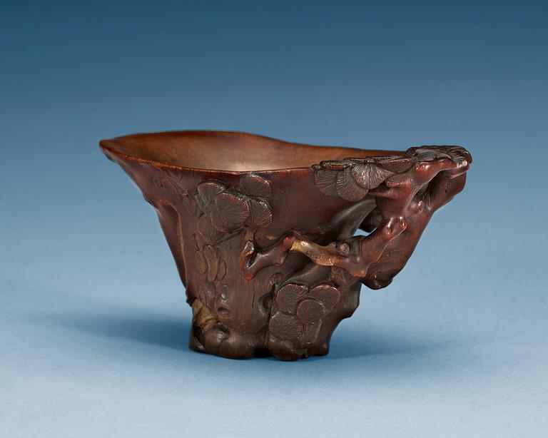 A carved rhinoceros libation cup, Qing dynasty, 18th Century.