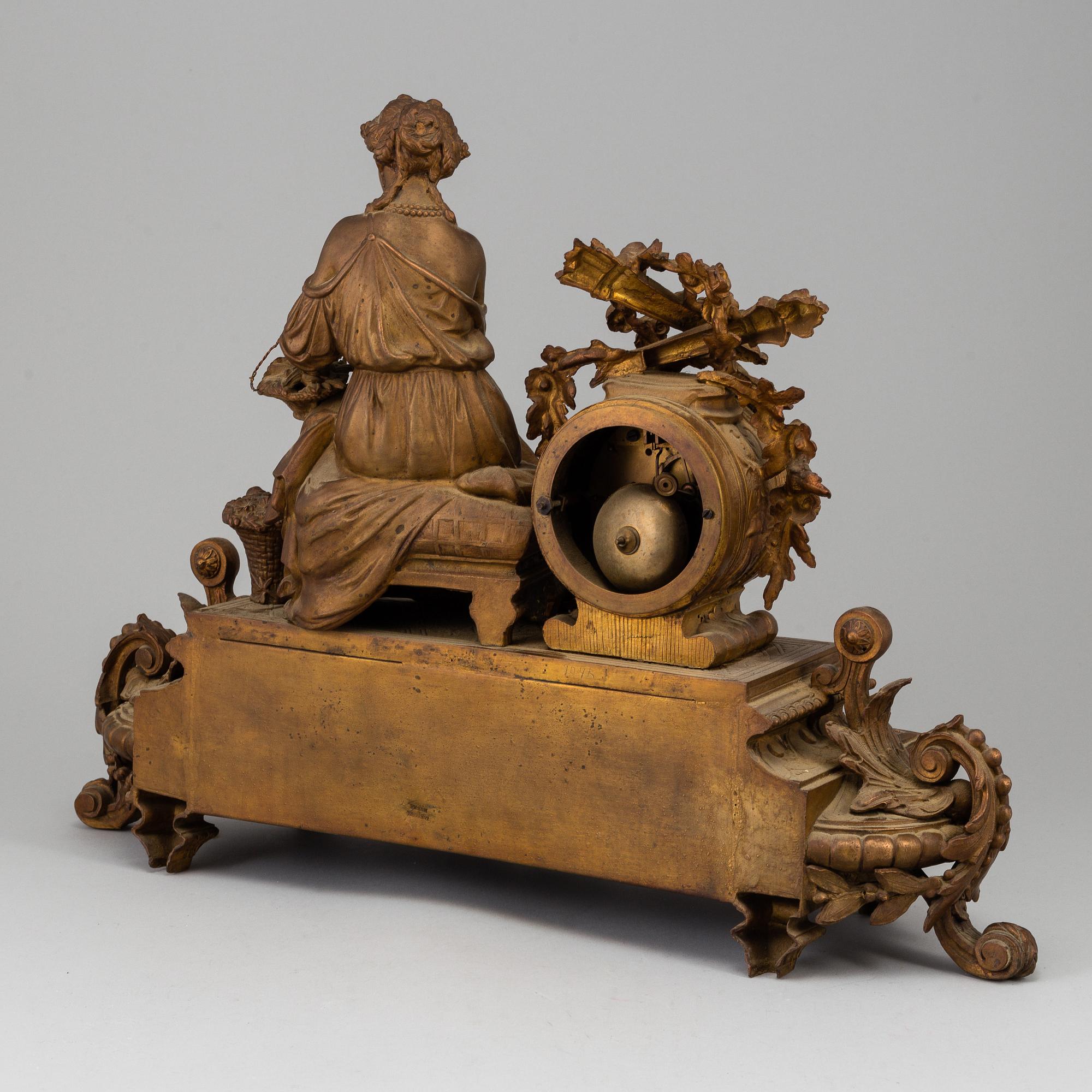 A  French 19th century mantle clock in Louis-XVI style.