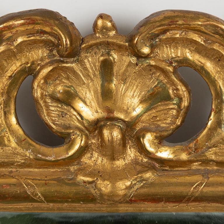 A rococo mirror, mid 18th century.