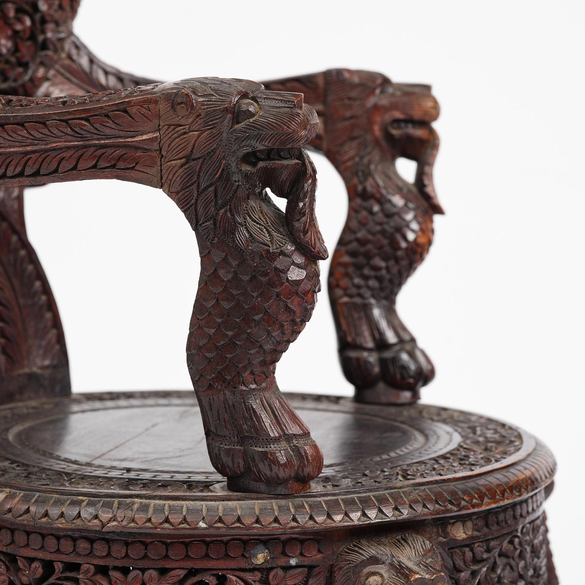 A pair of carved 'blackwood' armchairs, Bombay presidency, British Raj, circa 1880.