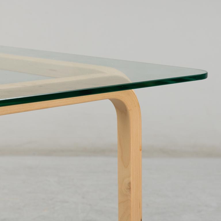 ALVAR AALTO, a pair of birch glass-top side tables from Arkek, Finland.