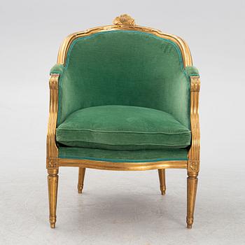 A Gustavian style armchair, circa 1900.