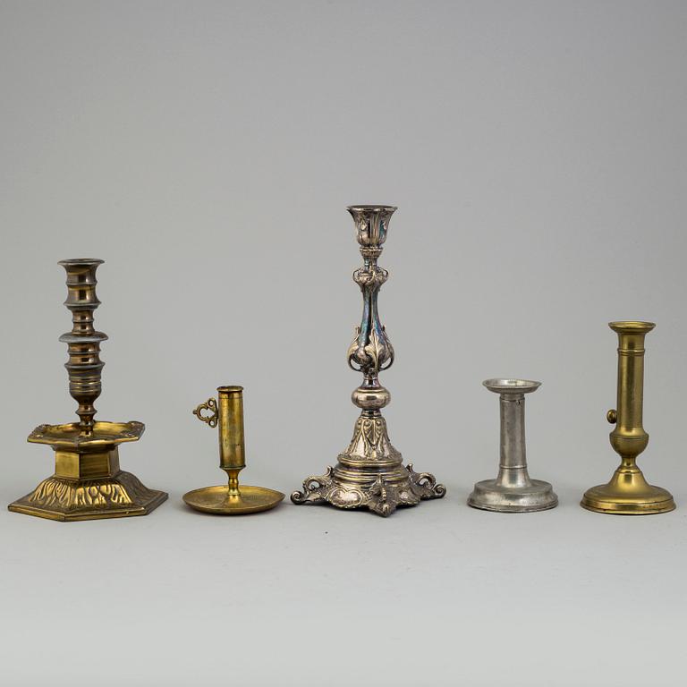 FIVE BRONZE, BRASS AND PEWTER CANDLESTICKS, 18th/19th century.