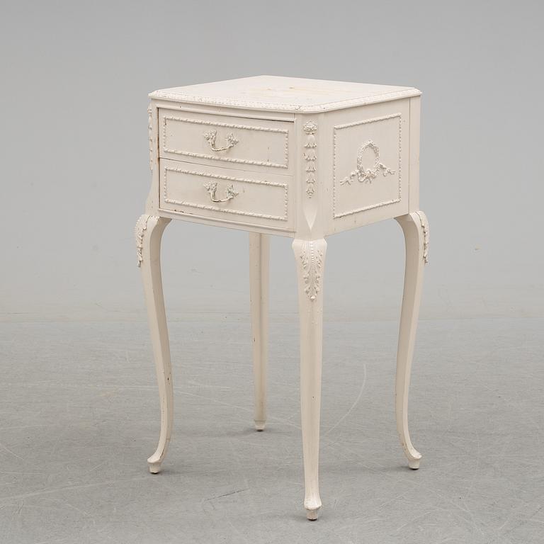 A 20th century rococo style bedside table.