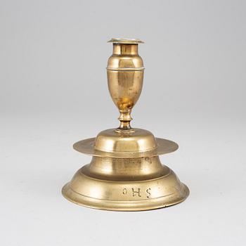 A 17th century bronze candlestick.