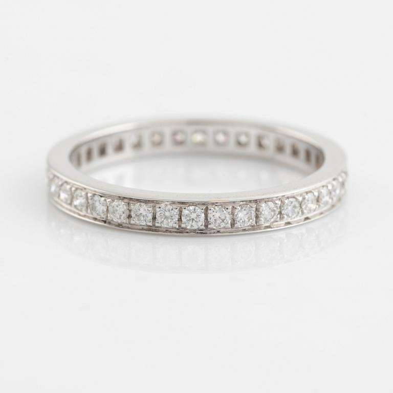 Brilliant cut diamond eternity ring.
