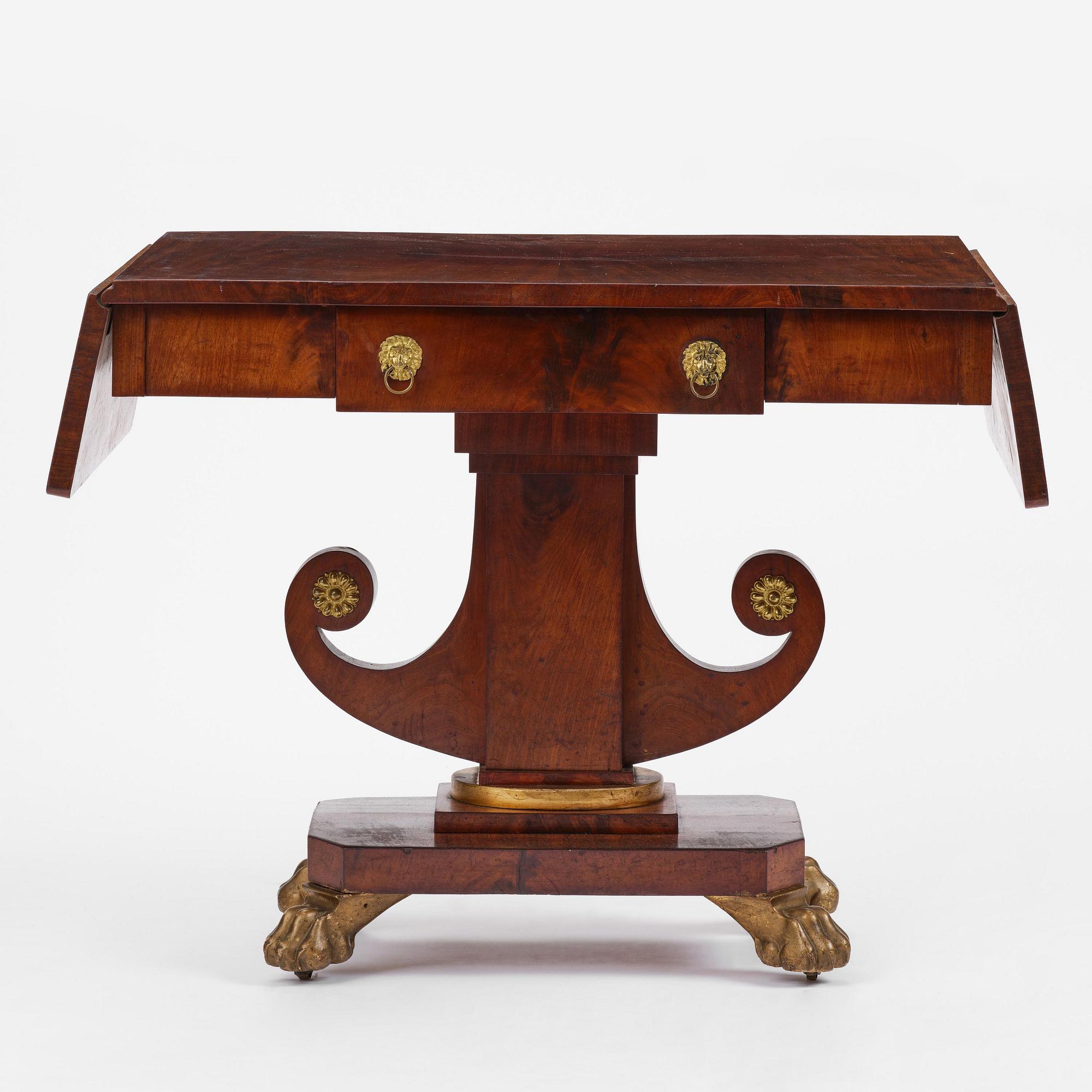 A Swedish Empire mahogany center table.