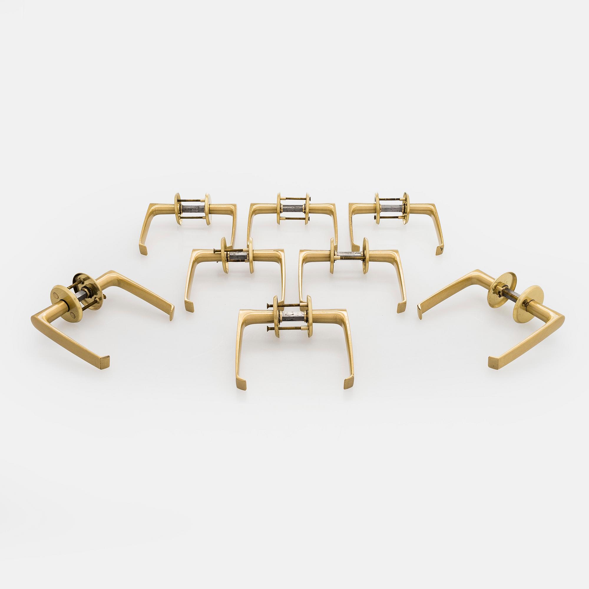 A set of eight 1960s-70s door handles.