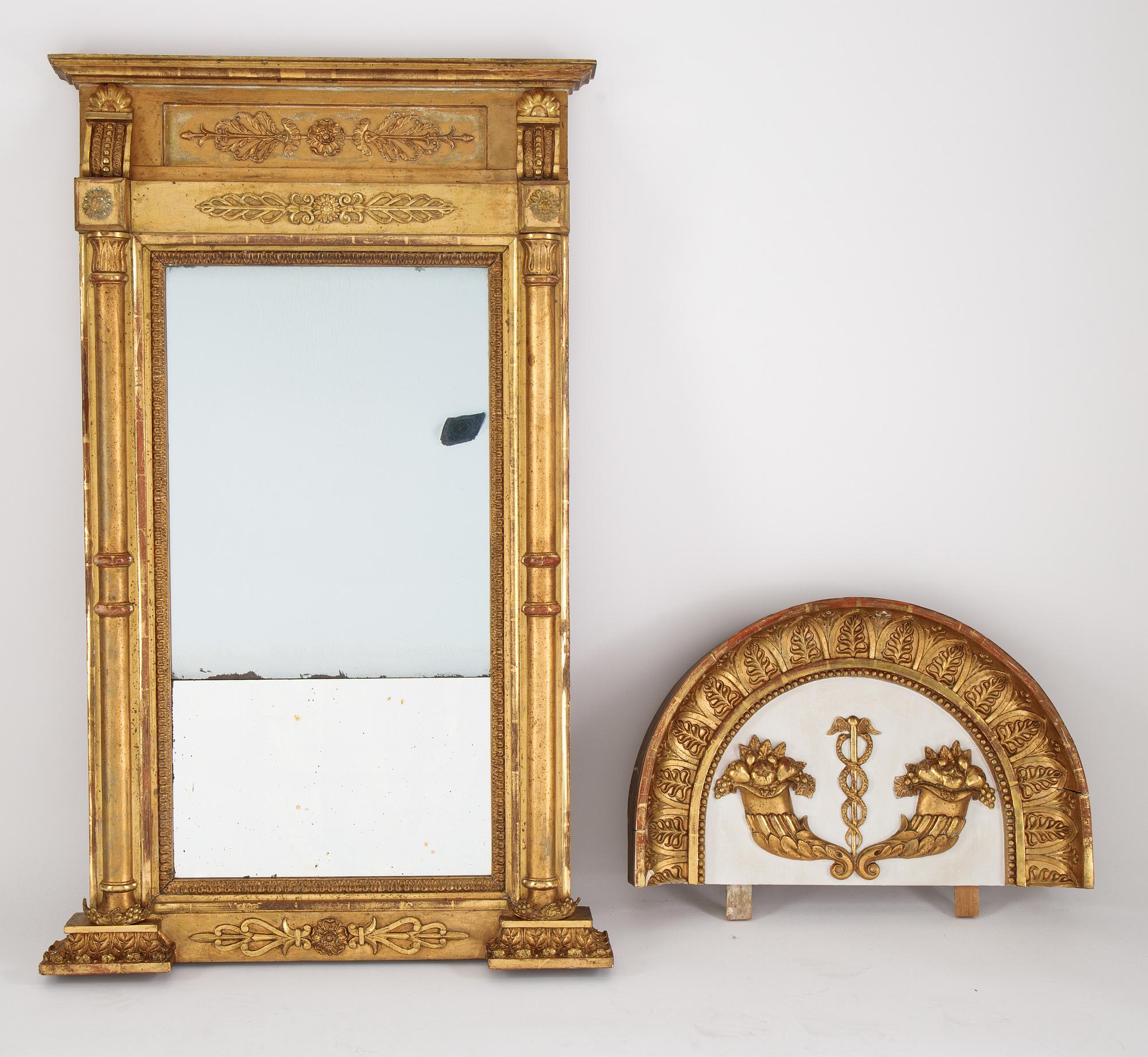 An Swedish Empire mirror, first half of the 19th century, attributed to Petter Gustaf Bylander, (Gothenburg 1802-59).
