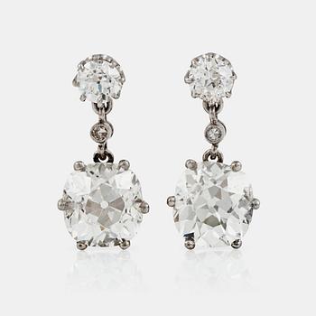 1162. A pair of cushion-cut diamond earrings. Total carat weight of diamonds circa 7.80 cts.