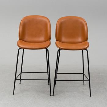 GAMFRATESI, a pair of 'Beetle Bar' leather chairs from GUBI.