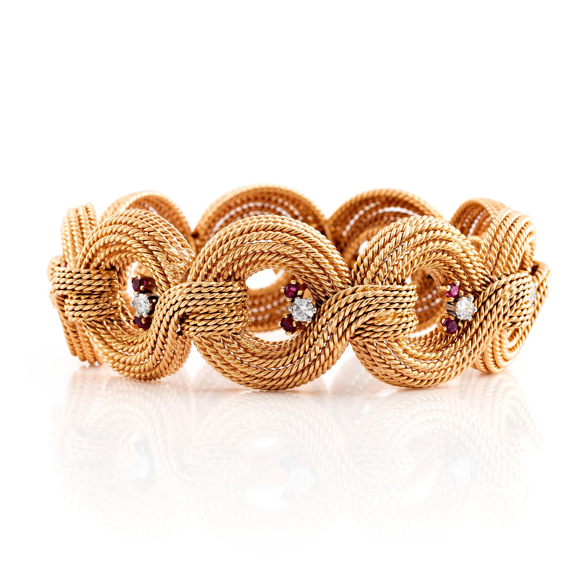 Armband 18K guld med runda briljantslipad diamanter och rubiner.