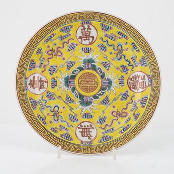 A Chinese famille rose yellow ground medallion plate and coffeecup with saucer, late Qing dynasty/around 1900.
