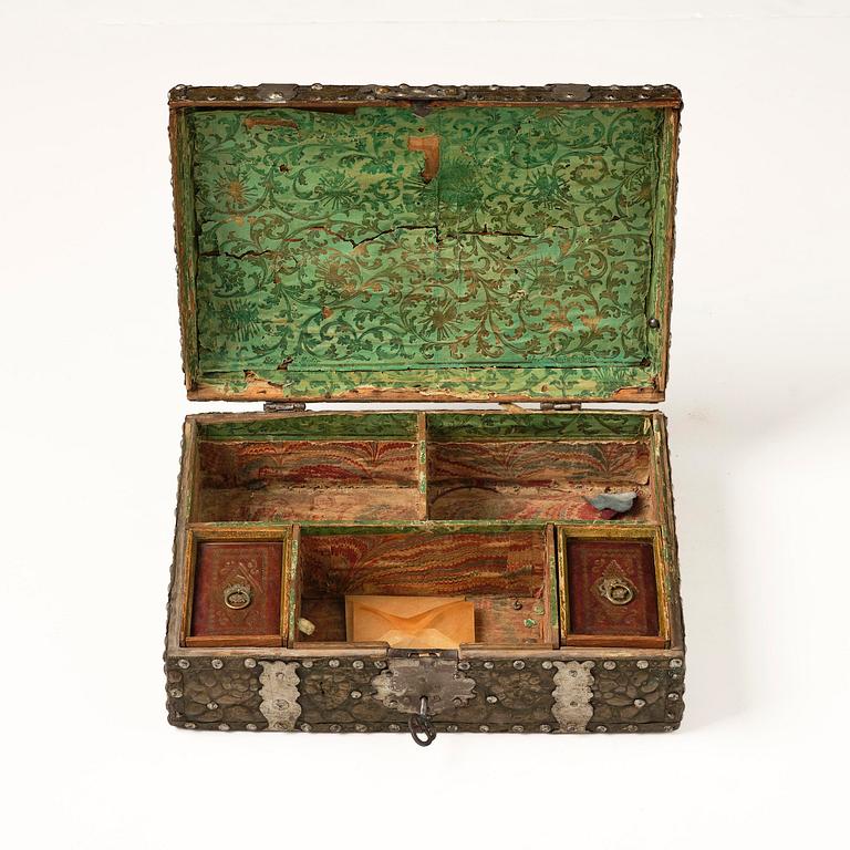 A presumably German baroque repoussé brass writing box, late 17th century.