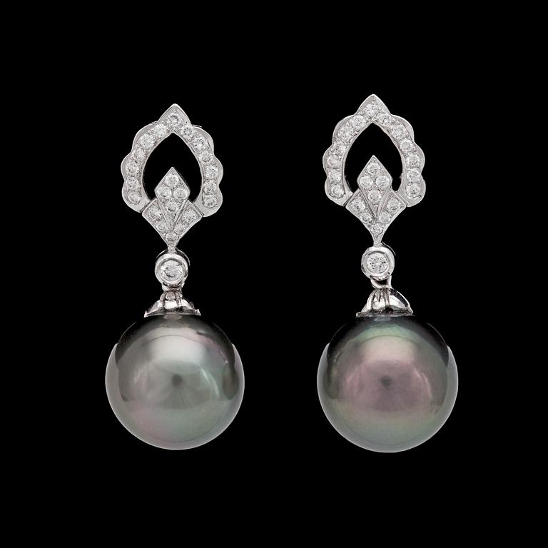 A pair of cultured Tahitit pearl, 14,4 mm, and diamond earrings, tot. app. 0.50 cts.