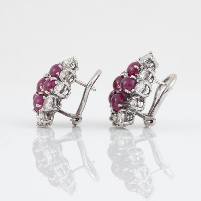 A pair of ruby, ca 4.00 cts, and diamond, circa 3.20 cts, earrings.