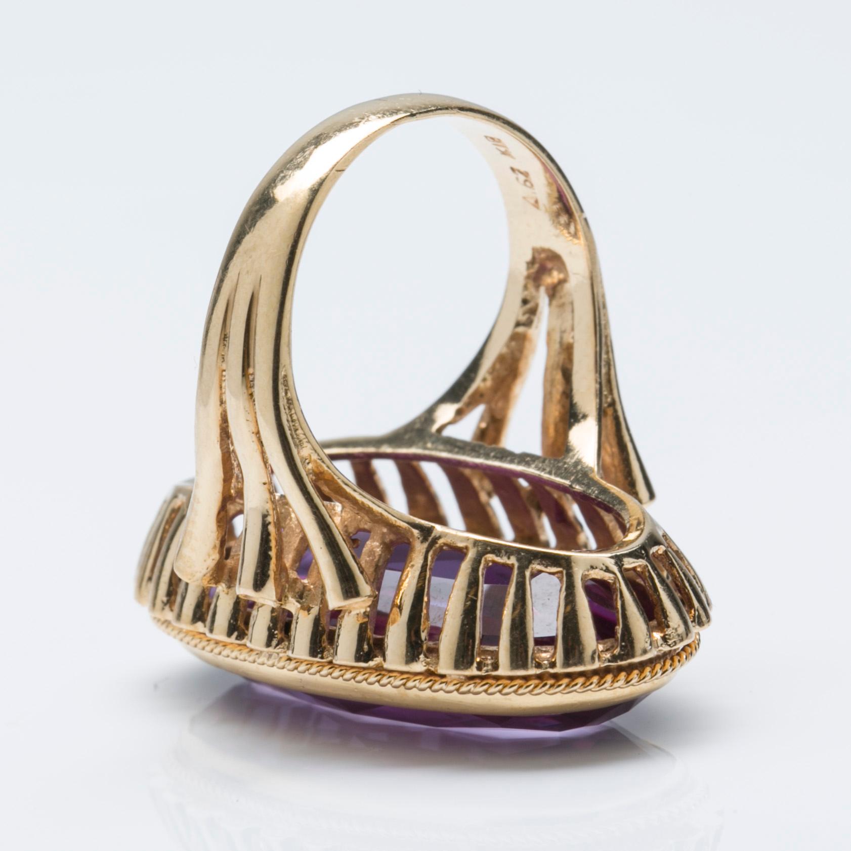 A synthetic alexandrite ring, 18K gold.