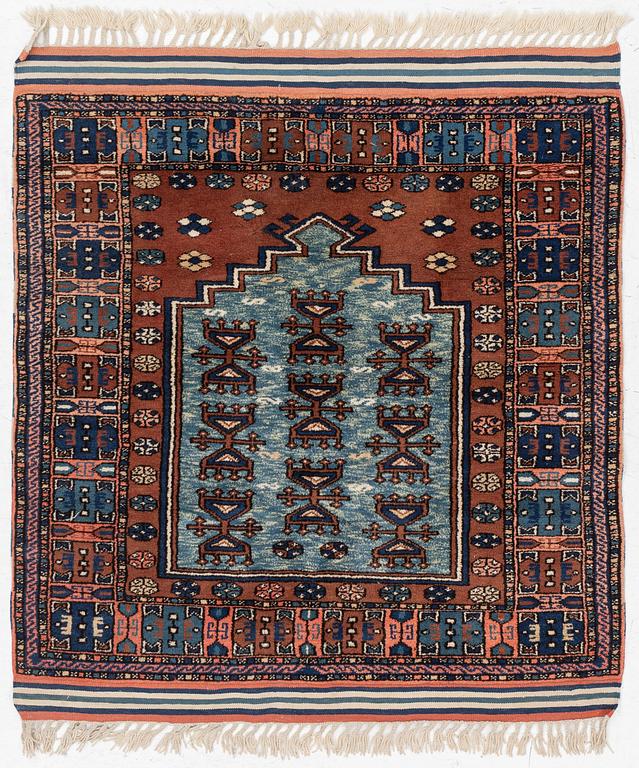 A semi-antique Anatolian rug, c. 127 x 117 cm.