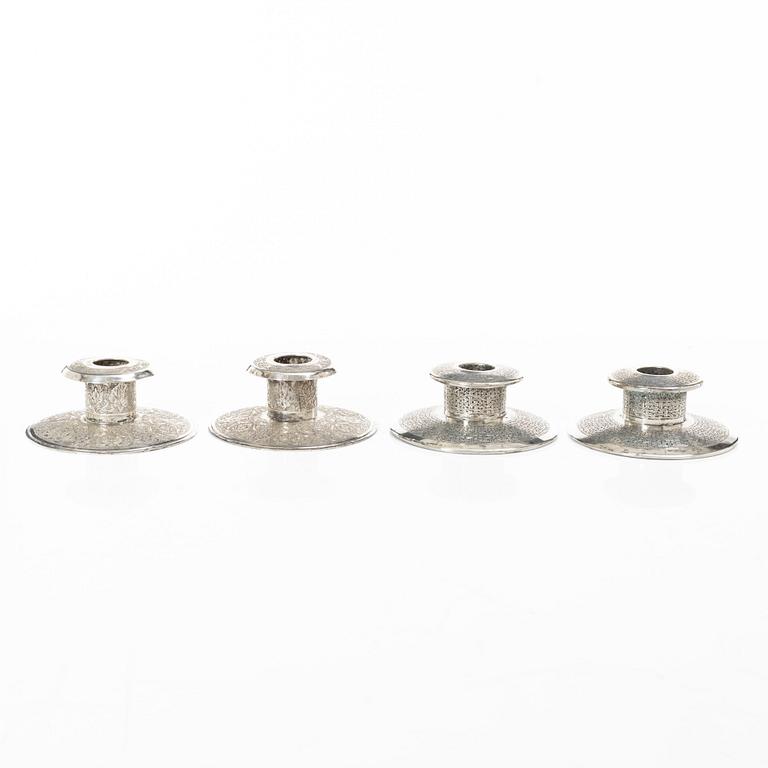 Two pairs of Persian silver candle holders, 20th century.