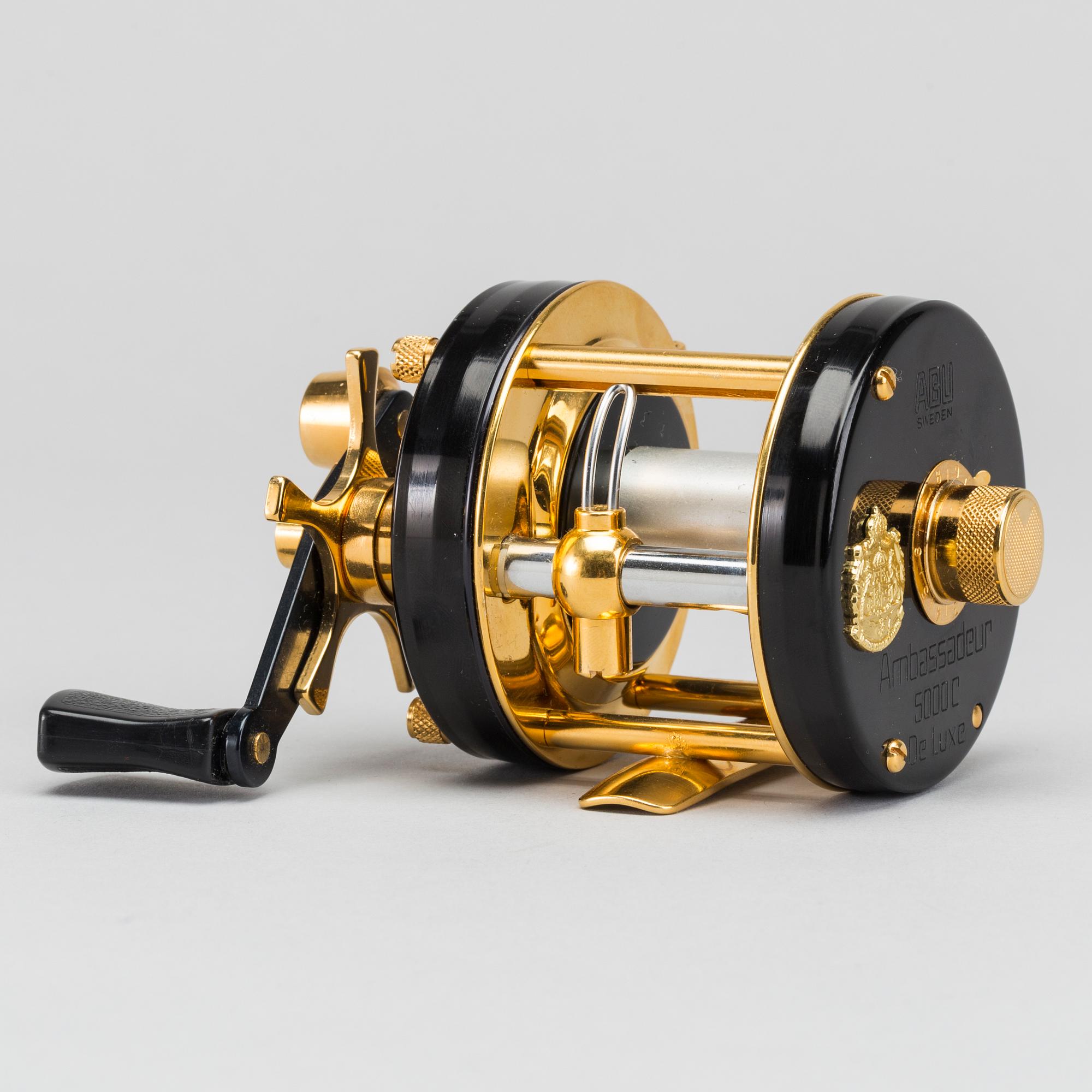 A guilded Ambassadeur 5000C De Luxe REEL BY ABU, SWEDEN. 1982