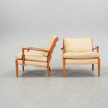 A pair of easy chairs by Arne Norell, late 20th century.